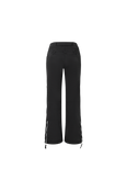The back of the starred ski pants in black featuring stars along the legs and back